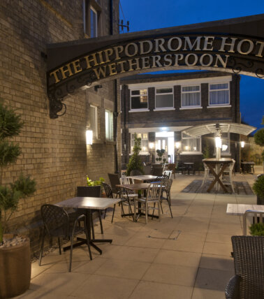 The Hippodrome, March outdoor seating with overhead signage